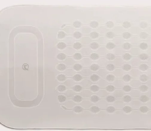 Primer plano de una esterilla blanca con textura de puntos en relieve