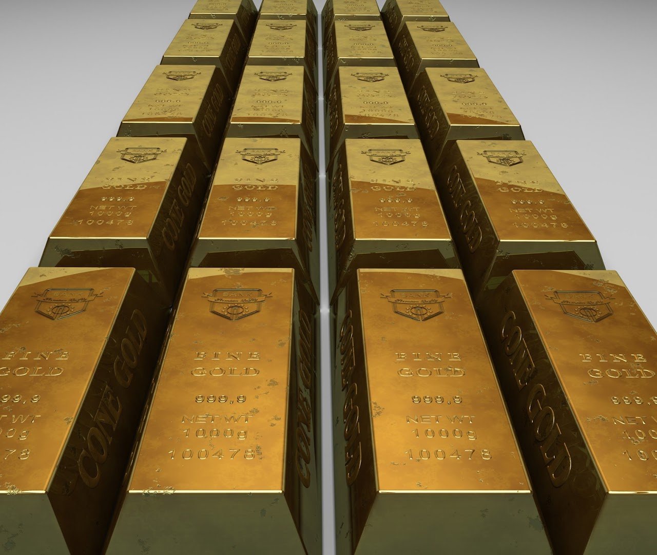 Filas de lingotes de oro apilados con el sello Fine Gold 999.9